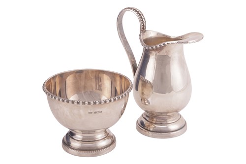 Lot 250 - A boxed silver sugar bowl and cream jug;...