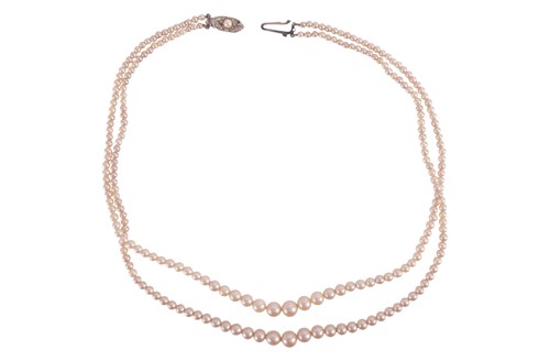 Lot 22 - A double row cultured pearl necklace,...