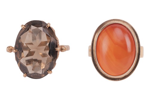 Lot 23 - Two cocktail rings; the first set with an oval...