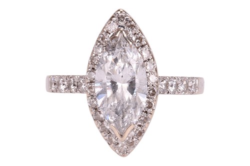 Lot 102 - A diamond solitaire ring, featuring a central...