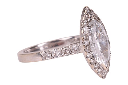 Lot 102 - A diamond solitaire ring, featuring a central...