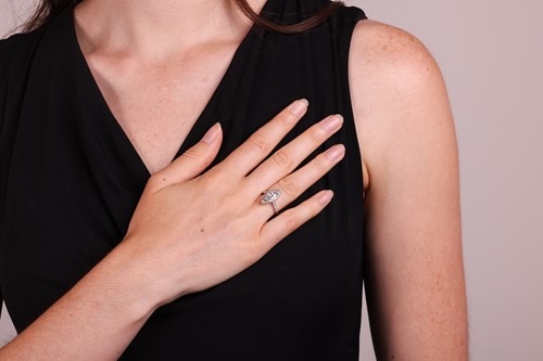 Lot 102 - A diamond solitaire ring, featuring a central...