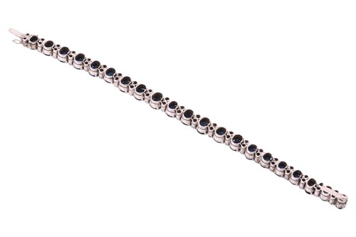 Lot A sapphire and diamond-set bracelet, featuring...