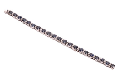 Lot A sapphire and diamond-set bracelet, featuring...