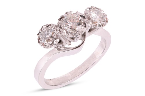 Lot A diamond-set three-stone ring, featuring...