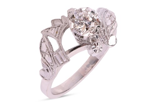 Lot A single-stone diamond ring, featuring an...