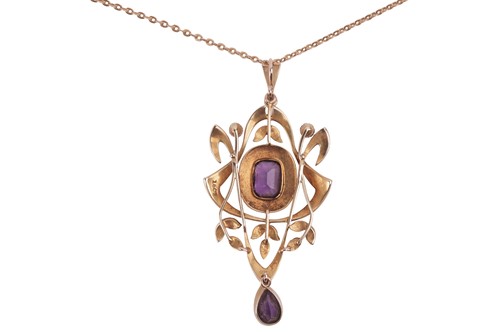 Lot An Edwardian amethyst and split pearl pendant...