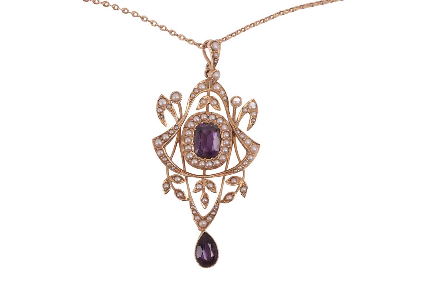 Lot An Edwardian amethyst and split pearl pendant...