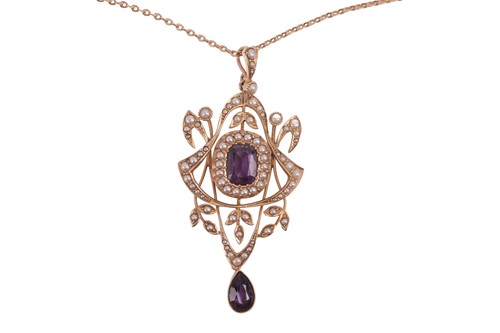 Lot 33 - An Edwardian amethyst and split pearl pendant...