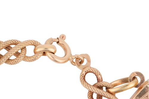 Lot 73 - An 18ct charm bracelet, the bracelet of fancy...