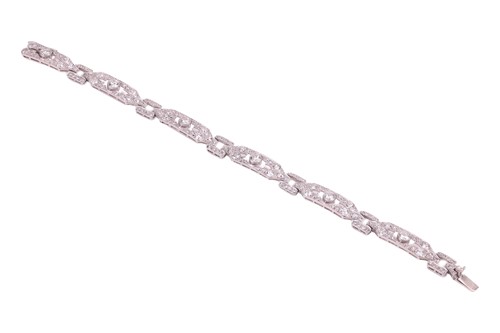 Lot 54 - An Edwardian diamond set bracelet, comprising...