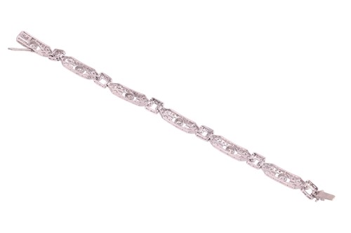 Lot 54 - An Edwardian diamond set bracelet, comprising...