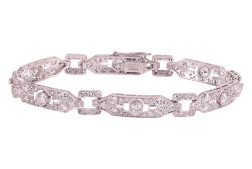Lot 54 - An Edwardian diamond set bracelet, comprising...