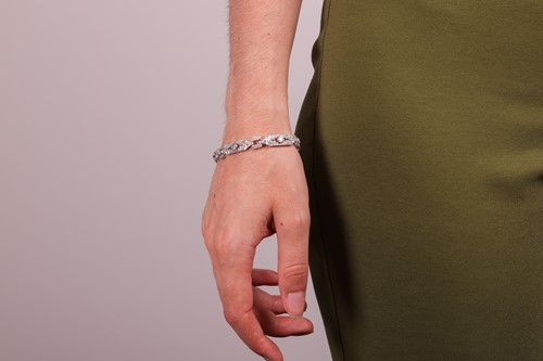 Lot 54 - An Edwardian diamond set bracelet, comprising...