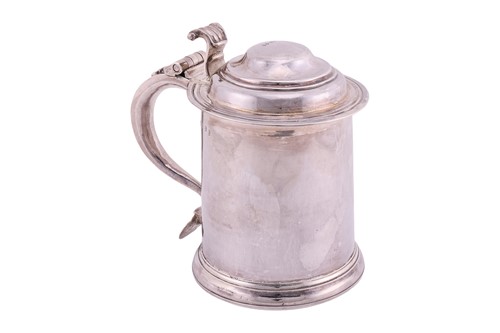 Lot 266 - A Queen Anne Britannia lidded silver tankard;...