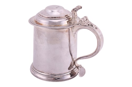 Lot 266 - A Queen Anne Britannia lidded silver tankard;...