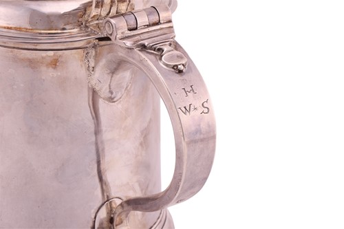 Lot 266 - A Queen Anne Britannia lidded silver tankard;...