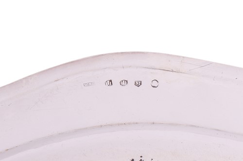 Lot A set of four George III Scottish silver meat...