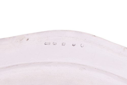 Lot A set of four George III Scottish silver meat...