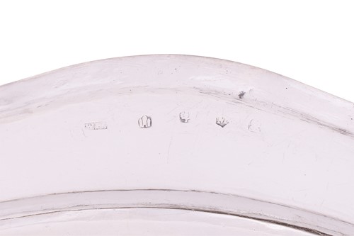 Lot A set of four George III Scottish silver meat...
