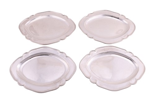 Lot A set of four George III Scottish silver meat...