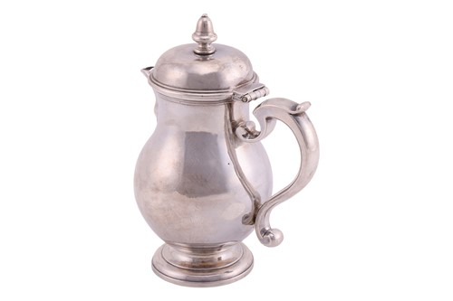 Lot A George I Scottish silver baluster jug,...