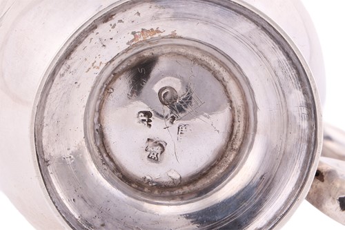 Lot A George I Scottish silver baluster jug,...
