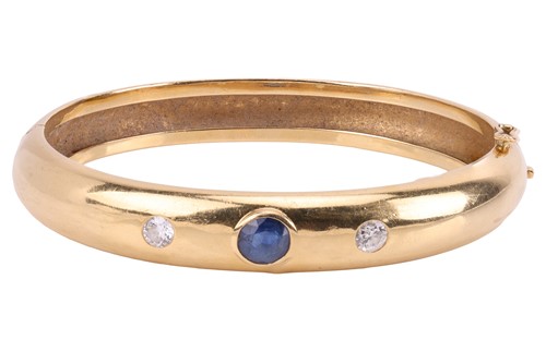 Lot A sapphire and diamond set hinged bangle, set...
