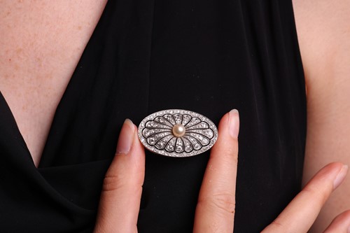 Lot A pearl and diamond-set plaque brooch,...