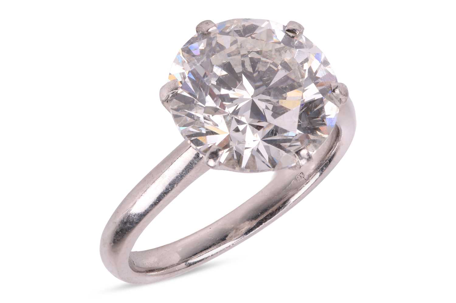 Lot A diamond solitaire ring, featuring a round...