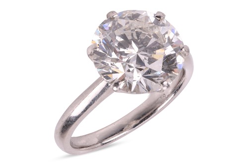 Lot A diamond solitaire ring, featuring a round...