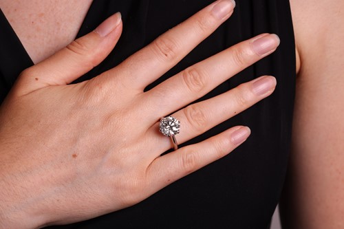 Lot A diamond solitaire ring, featuring a round...