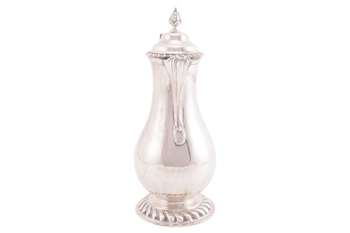 Lot A silver baluster hot water jug of George I...