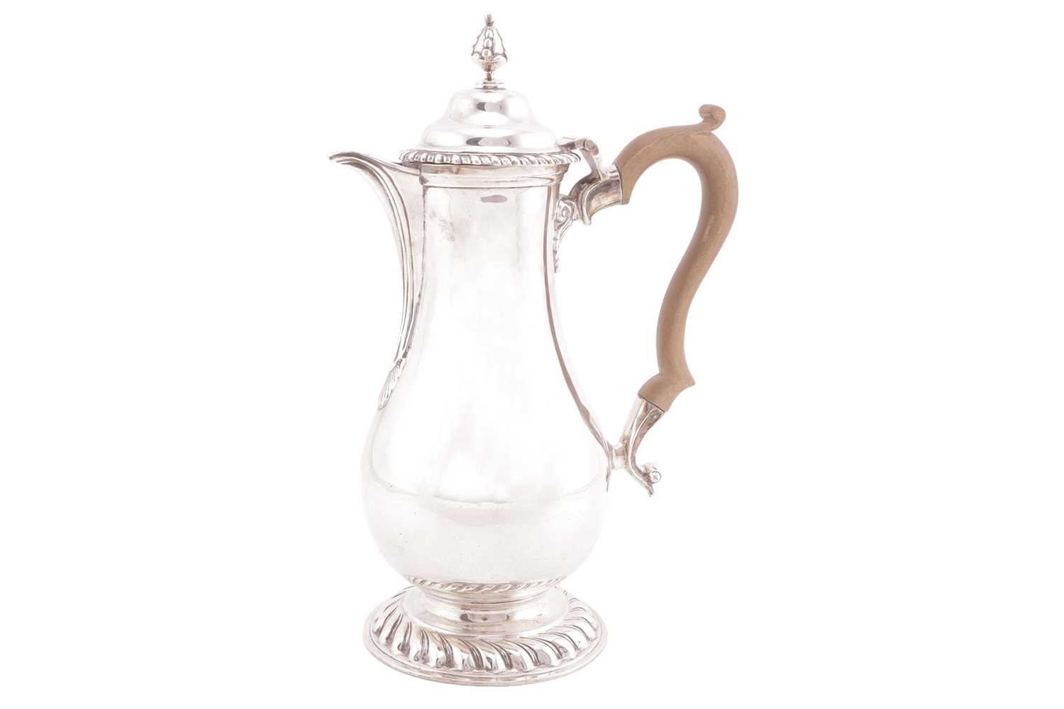 Lot A silver baluster hot water jug of George I...