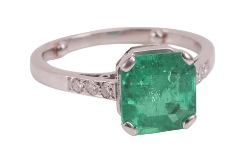 Lot A Colombian emerald dress ring, claw-set with...
