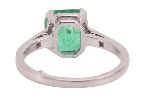Lot A Colombian emerald dress ring, claw-set with...