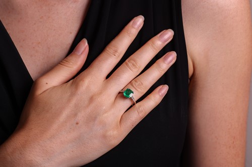 Lot A Colombian emerald dress ring, claw-set with...