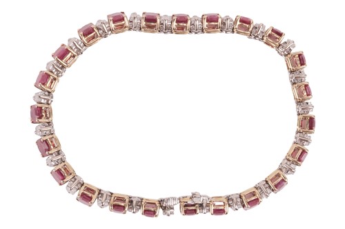 Lot A ruby and diamond line bracelet, set with...