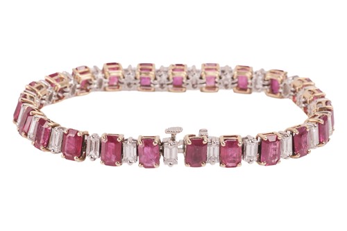 Lot A ruby and diamond line bracelet, set with...