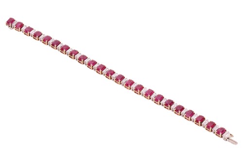 Lot A ruby and diamond line bracelet, set with...