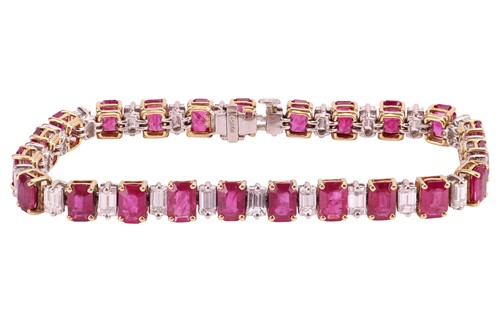 Lot A ruby and diamond line bracelet, set with...