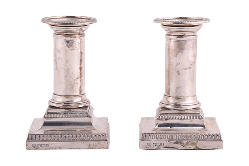 Lot 218 - A pair of silver dwarf candlesticks, by...