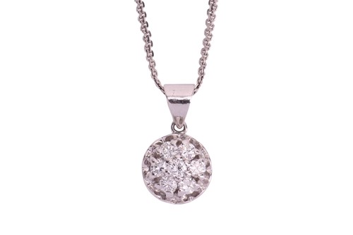 Lot A diamond pendant and earring set, the pendant...