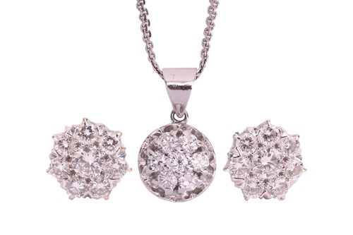 Lot A diamond pendant and earring set, the pendant...