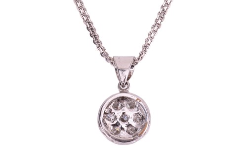 Lot A diamond pendant and earring set, the pendant...