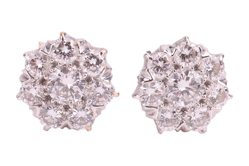 Lot A diamond pendant and earring set, the pendant...