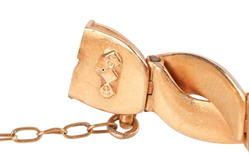 Lot A gem-set double snake head bracelet, hinged...