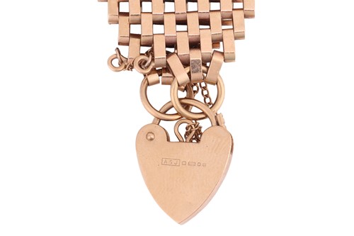 Lot A wide 9ct gold gate bracelet, with heart...