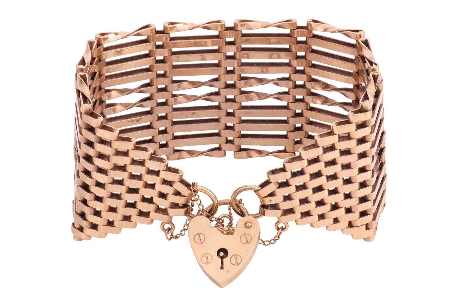 Lot A wide 9ct gold gate bracelet, with heart...