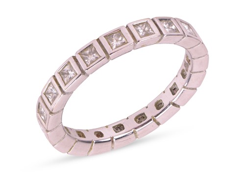 Lot 129 - A diamond eternity ring, comprising nineteen...